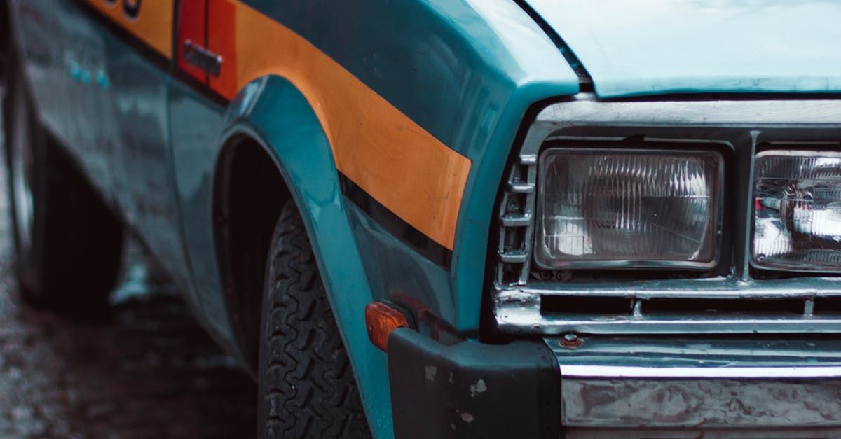 A close up of a blue and yellow car parked on the side of the road.  | Big Jim's Automotive