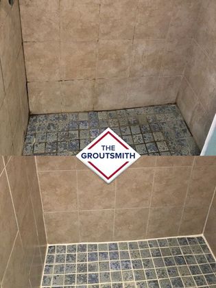 A bathroom with a sign that says the groutsmith