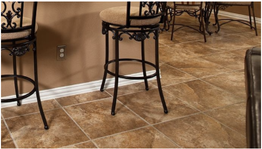 Two bar stools are sitting on a tiled floor in a room.