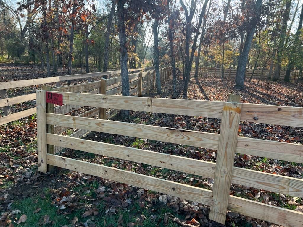 A wooden fence is in the middle of a forest. Clarksville,TN
