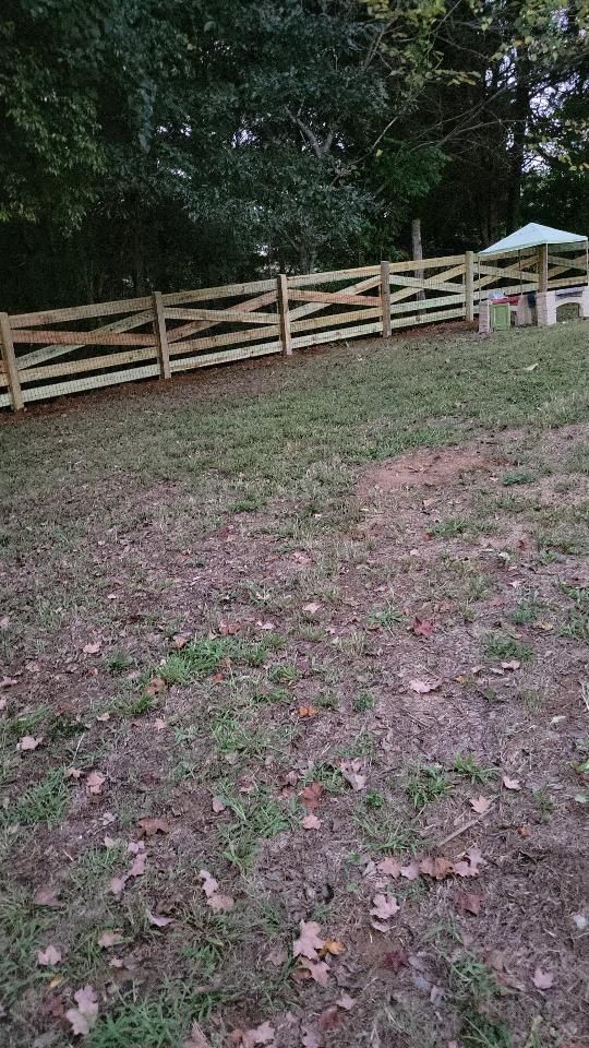 There is a wooden fence in the middle of a grassy field. Clarksville,TN