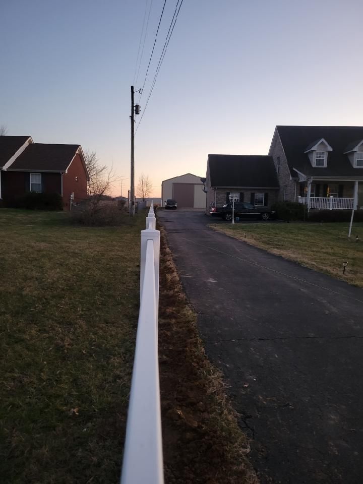 A white fence along the side of a road.Clarksville,TN