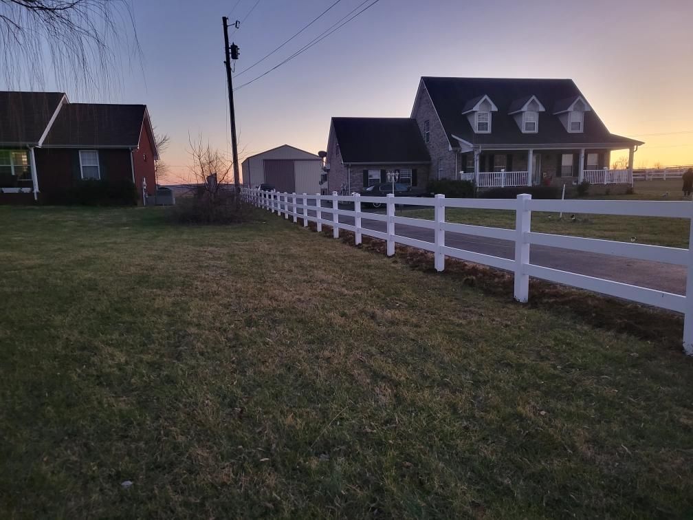 A white fence surrounds a row of houses. Clarksville,TN