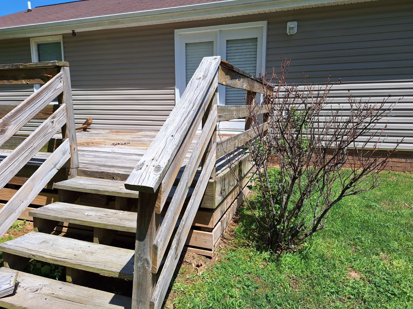 A wooden deck with stairs leading up to it Clarksville, TN