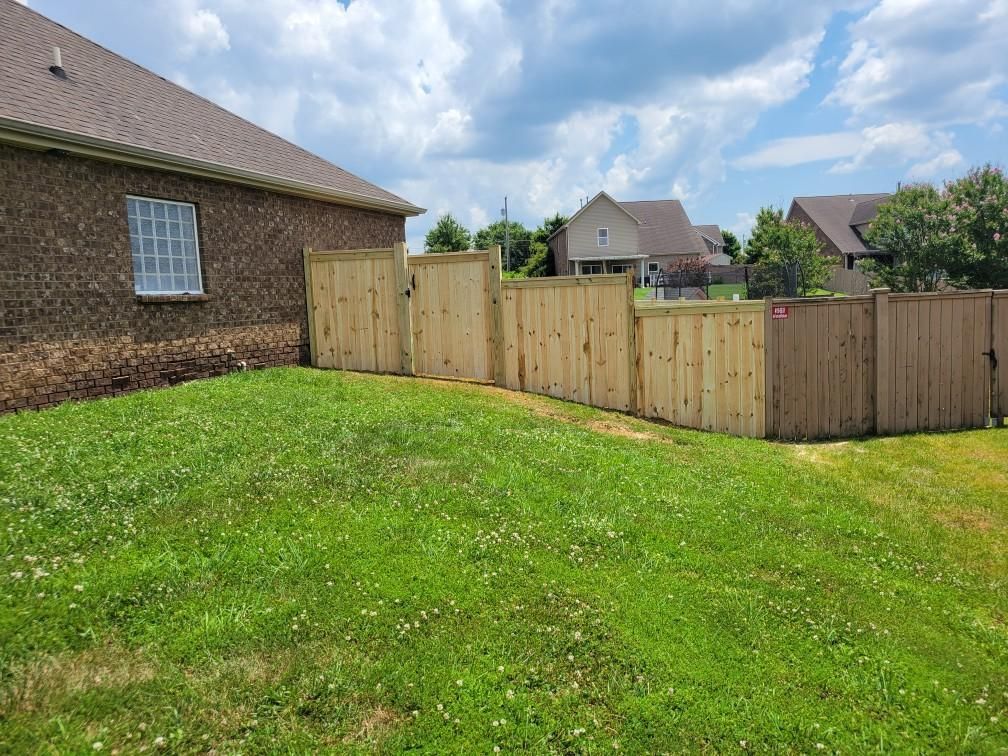 There is a wooden fence in the backyard of a house. Clarksville, TN