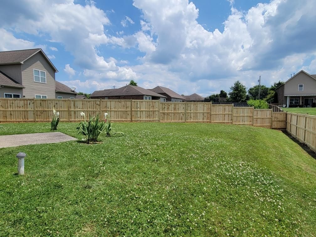 There is a wooden fence in the backyard of a house. Clarksville, TN