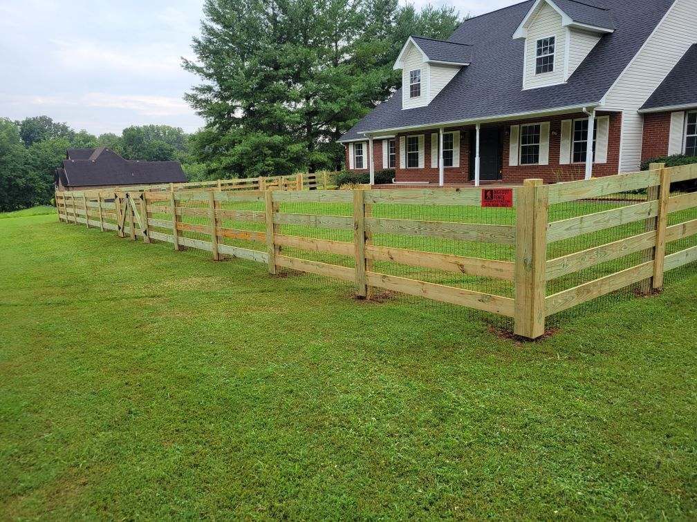 There is a wooden fence in front of a house. Clarksville, TN