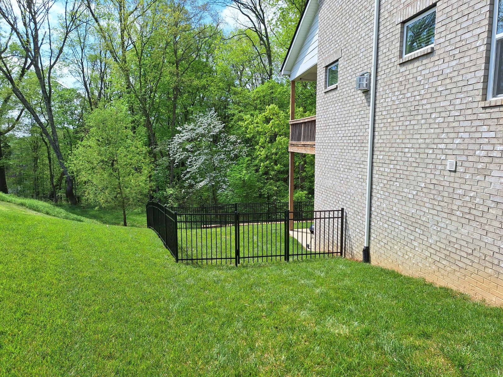 There is a fence in the backyard of a house. Clarksville, TN