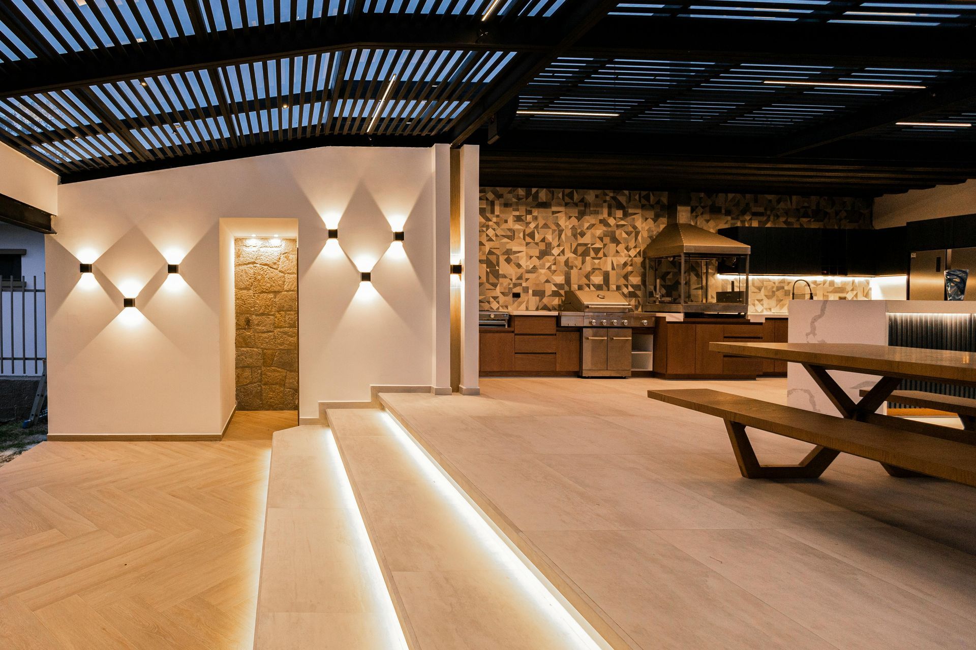 There is a picnic table in the middle of the room.