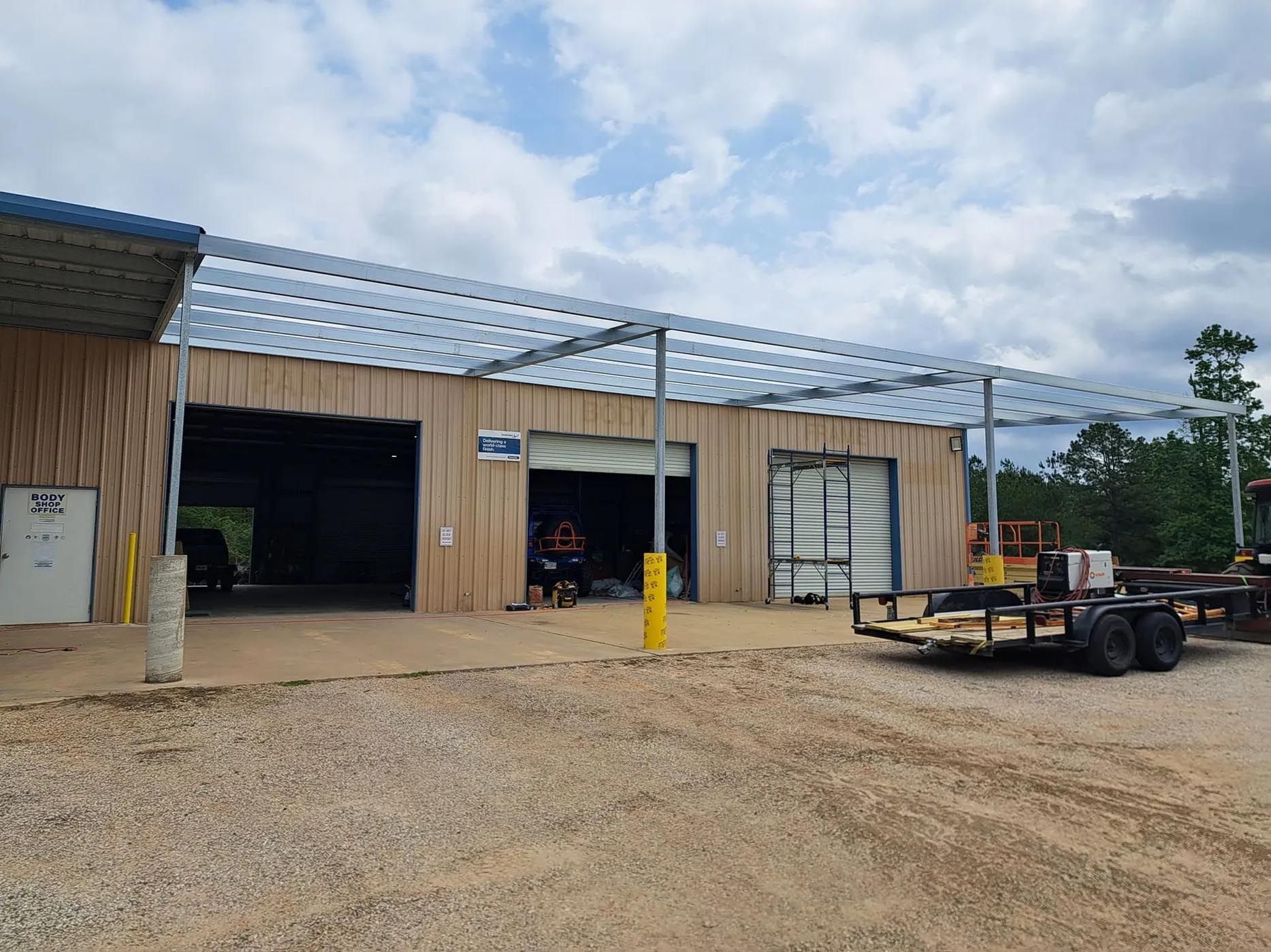A trailer is parked in front of a building.
