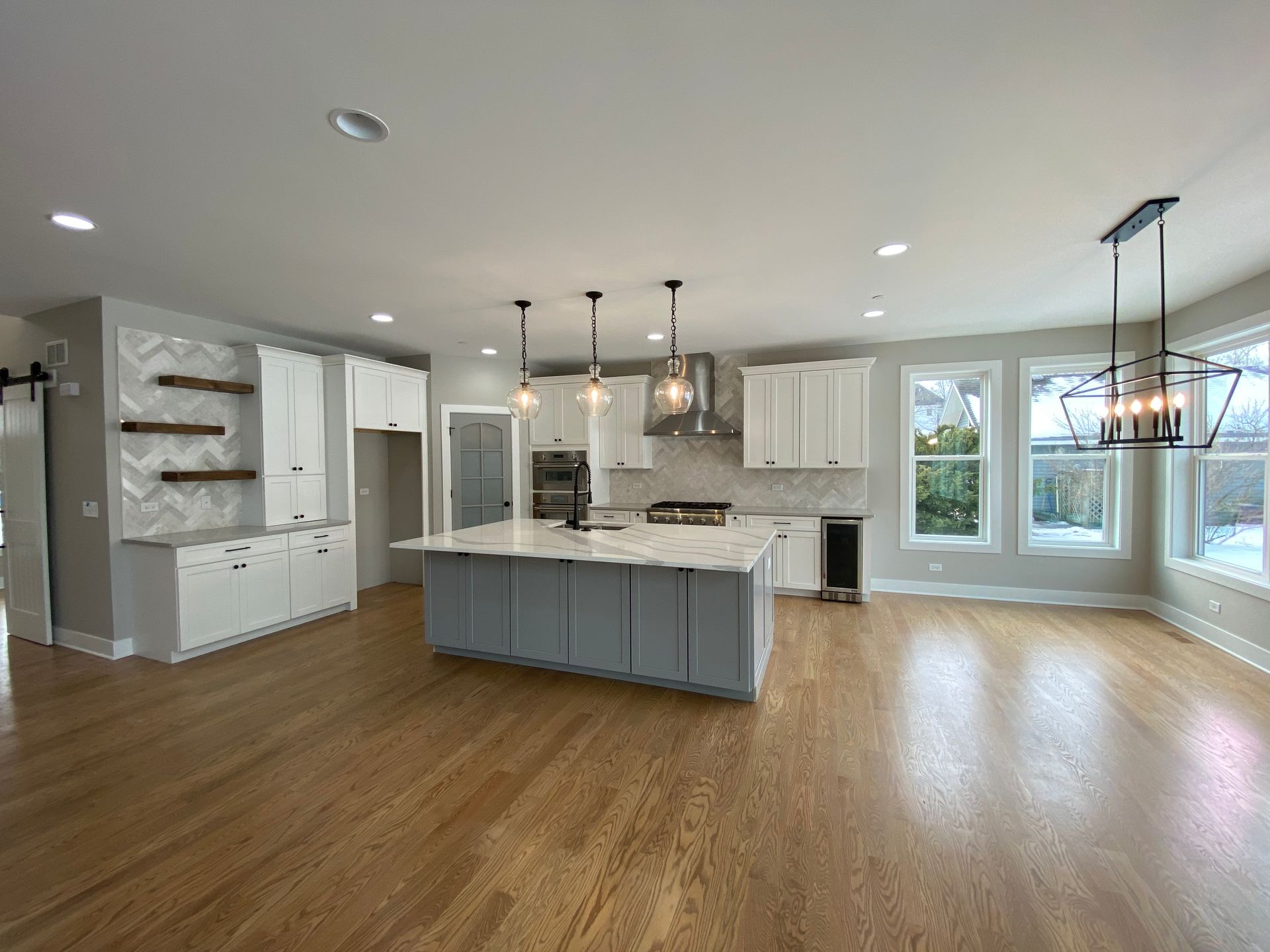 There is a large island in the middle of the kitchen.