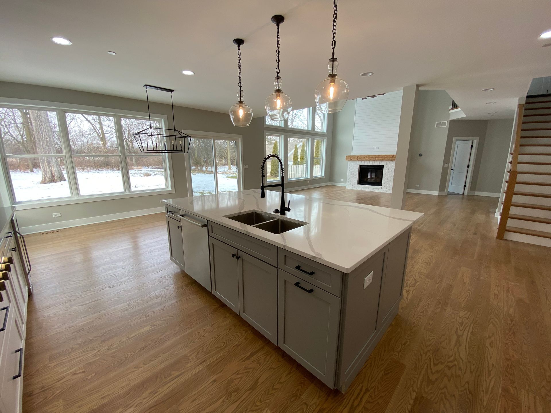 There is a large island in the middle of the kitchen.