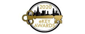 A logo for the 2020 ekey awards with a key and a city skyline.
