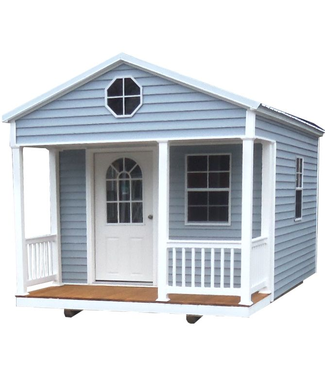Small light-blue house with white trim, front porch, and arched front door and window