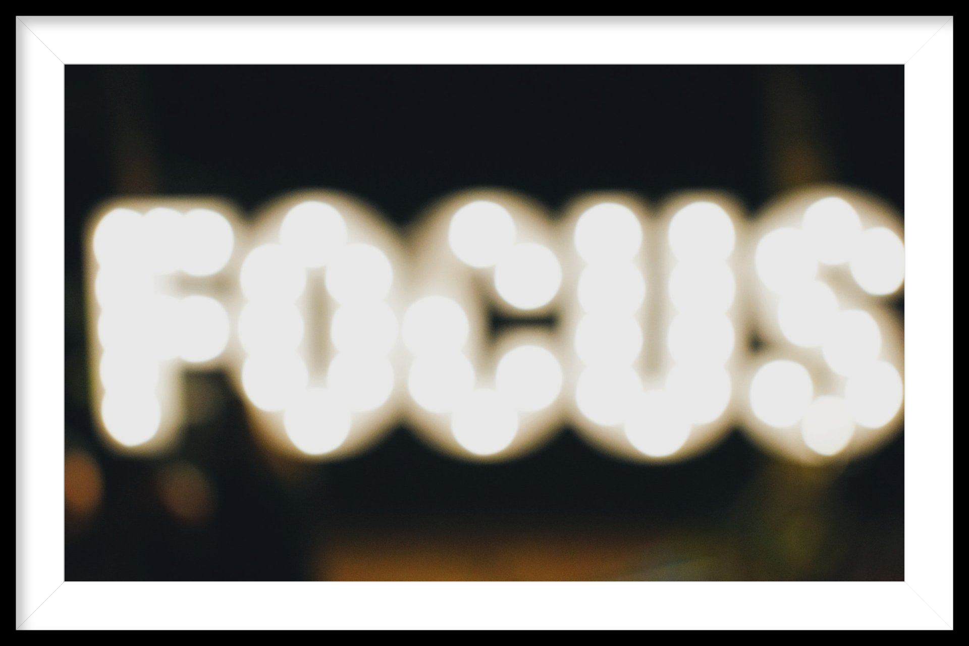 A blurry picture of the word focus in white letters