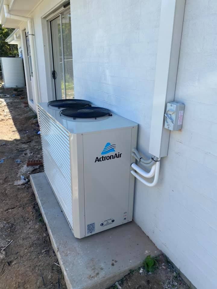 Air Conditioning Unit Outside a White Building, Labeled Actronair — Airset Air Conditioning in Woolgoolga, NSW