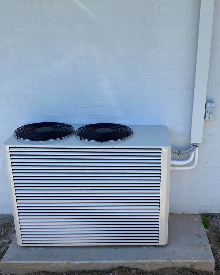 Air Conditioning Unit With Two Fans Mounted on a Concrete Pad — Airset Air Conditioning in Nambucca, NSW