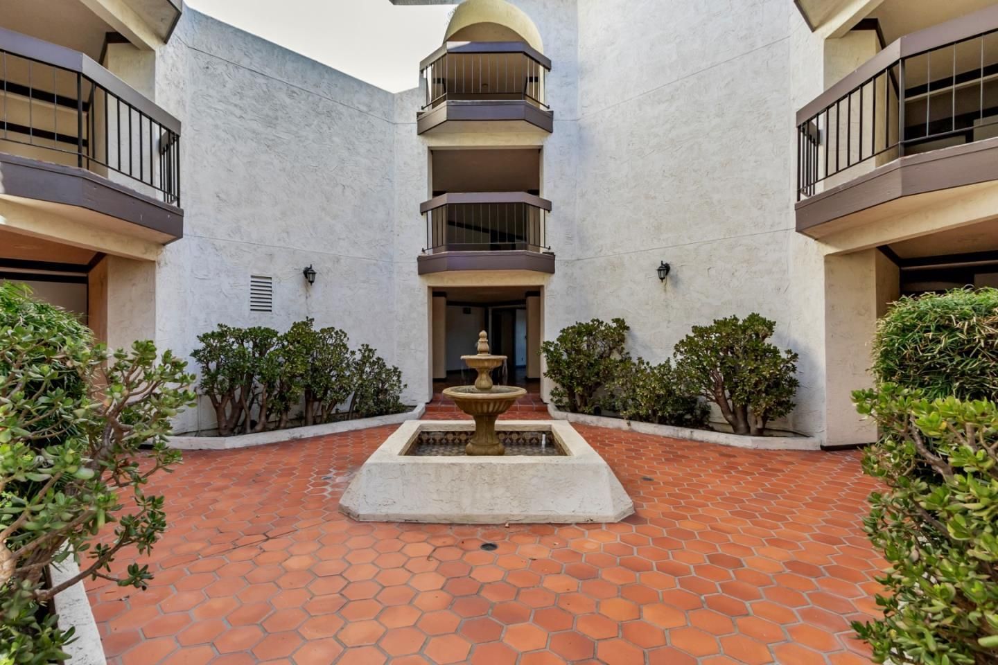 A building with a fountain in the middle of it
