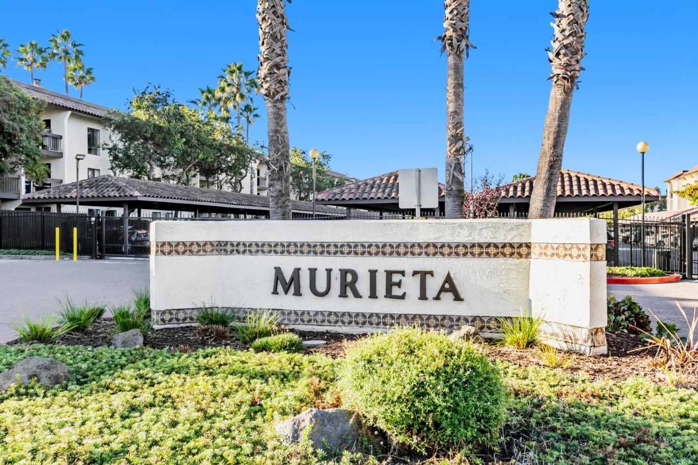 A white sign that says murieta is in front of a building.