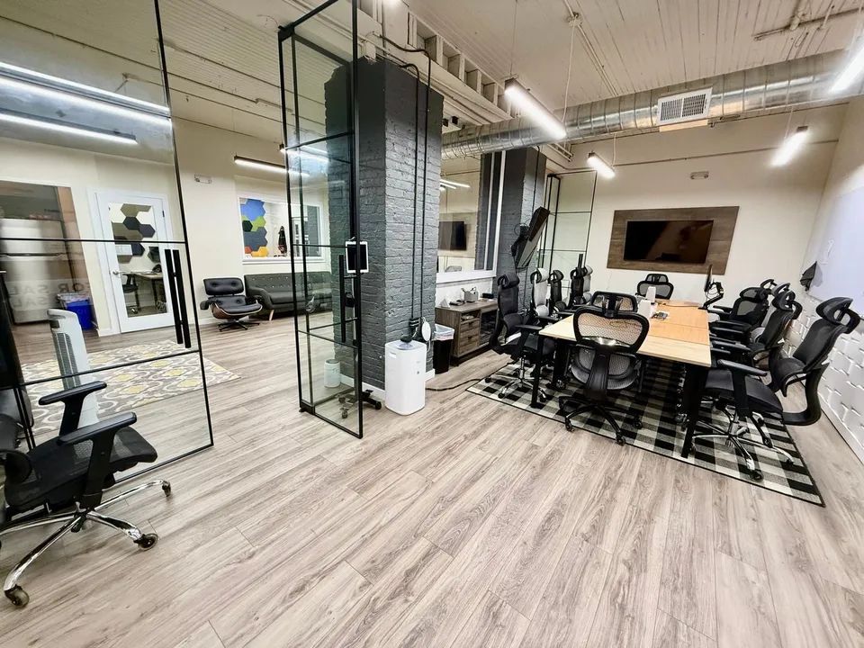 A conference room with a table and chairs in it.