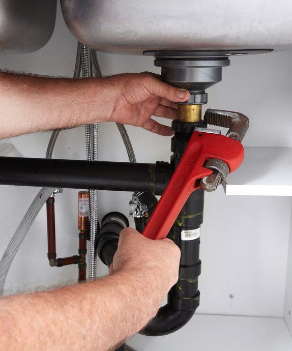 Professional Plumber With a Wrench — Plumbing in Cabarita Beach, NSW