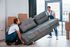 2 men moving couch