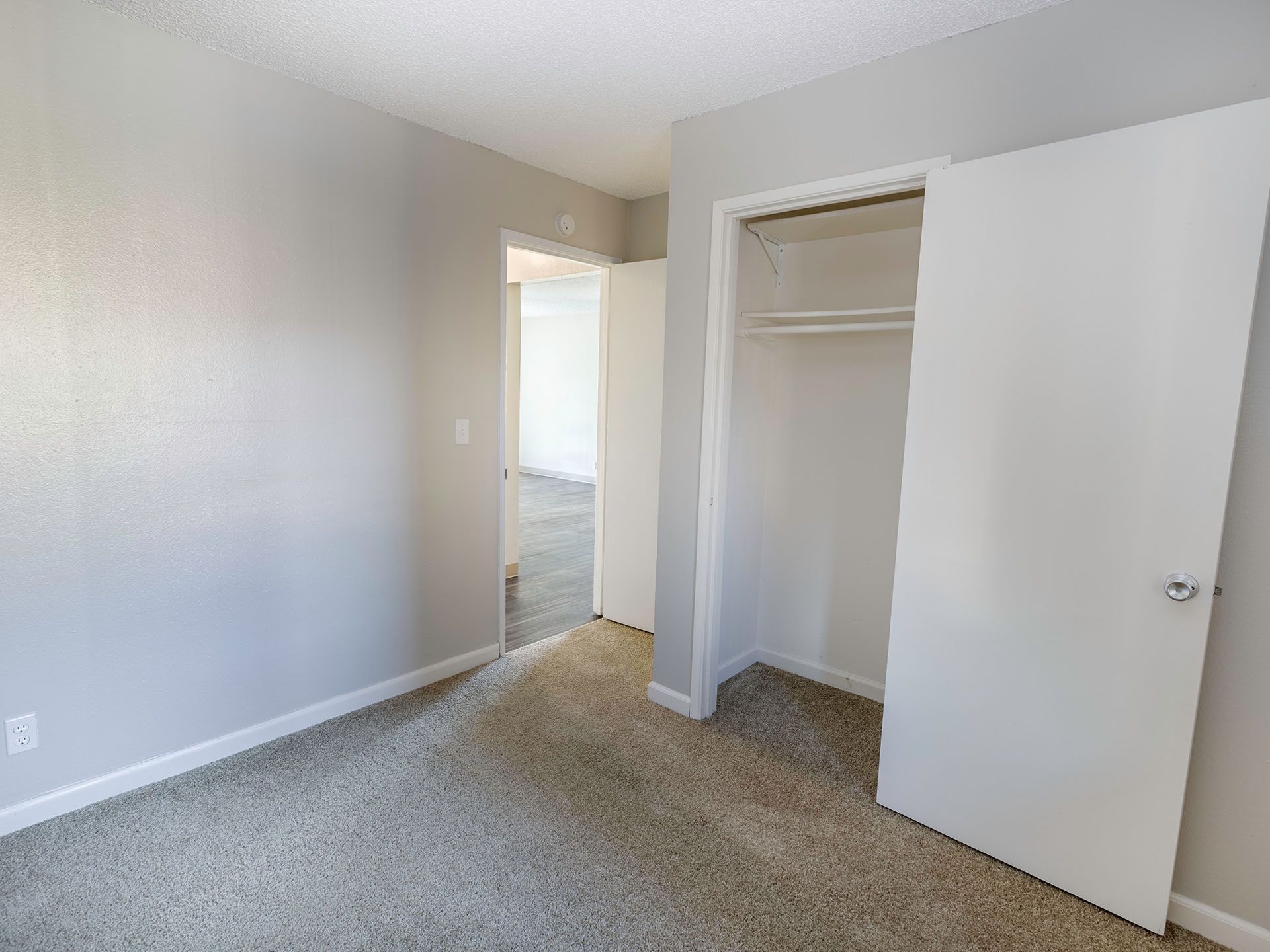 Photo of a bedroom with an open closet