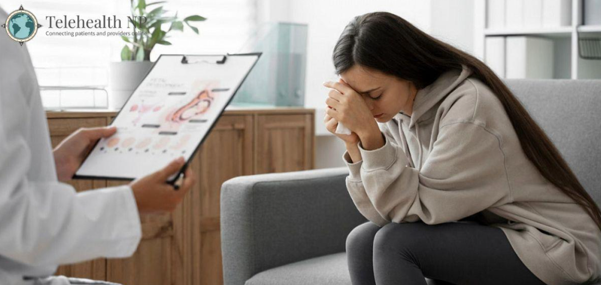 A doctor shows a chart to a young woman on a couch. The woman looks sad, holding her head. Telehealth logo.