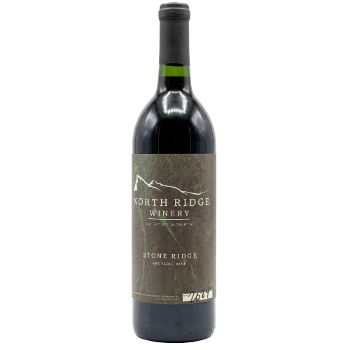 A dark glass bottle of North Ridge Winery red wine with a textured, stone-colored label and a mountain graphic.