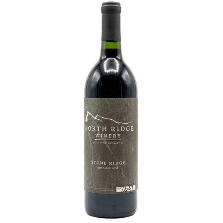 A dark glass bottle of North Ridge Winery red wine with a textured, stone-colored label and a mountain graphic.