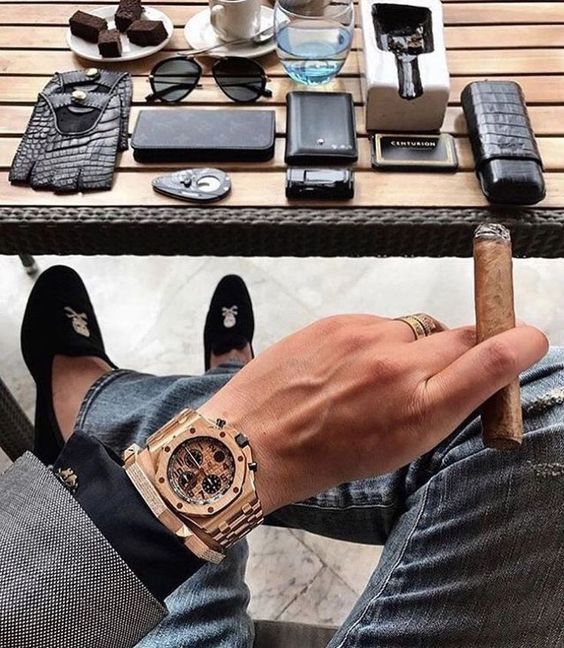 Businessmen wearing a audemars piguet luxury watch and smoking cigar