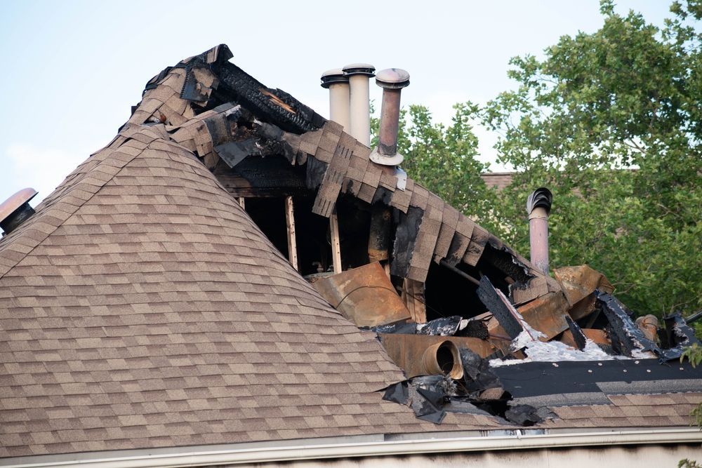 A roof of a house that has been damaged by a fire.