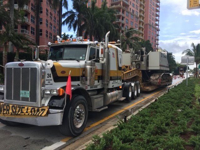 Yellow Automatic Hydraulic Truck — Opa-locka, FL — Sunshine Heavy Hauling, Inc.