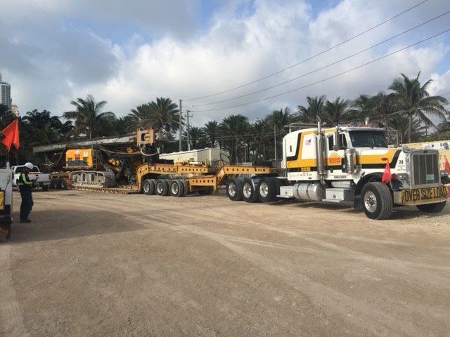 Yellow Trucks — Opa-locka, FL — Sunshine Heavy Hauling, Inc.