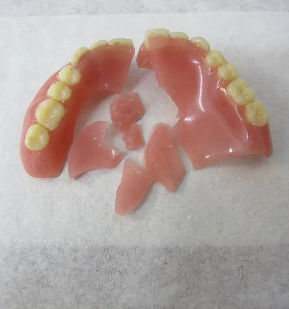 A Broken Denture Is Laying on a Piece of Paper | Lismore, NSW | Active Denture Clinic