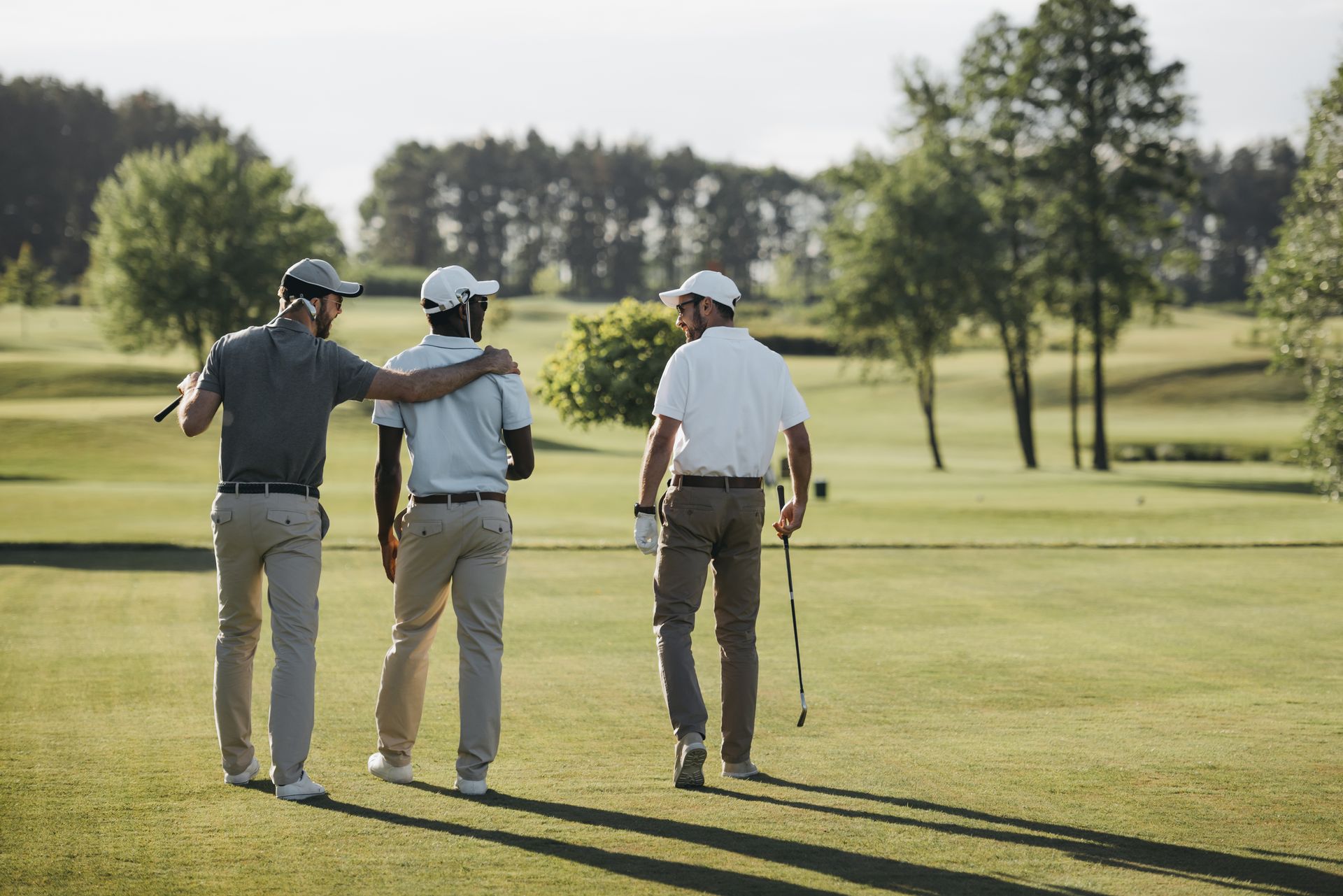 Group of men playing golf ©LightField Studios