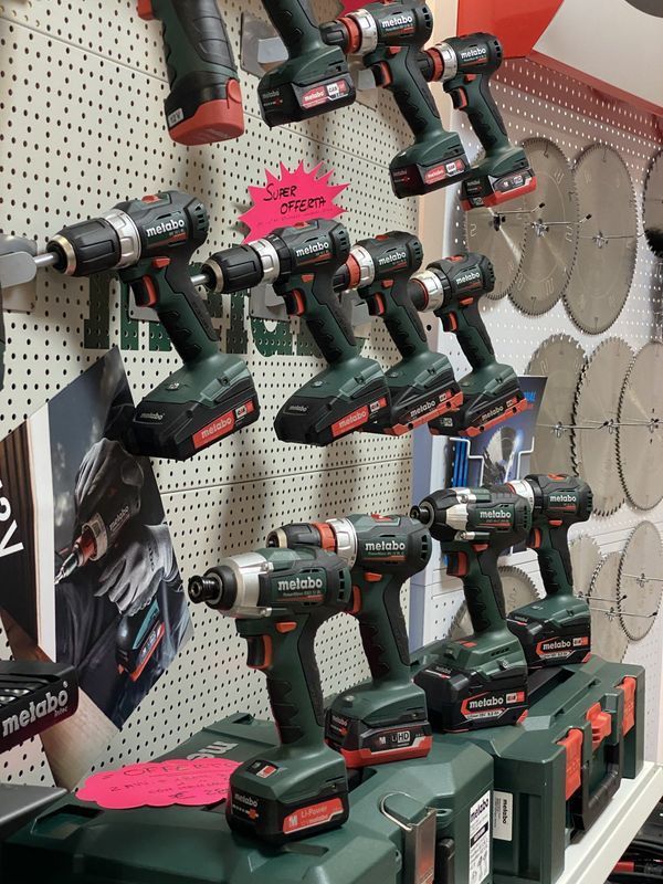 Two drill bits are sitting on a table.