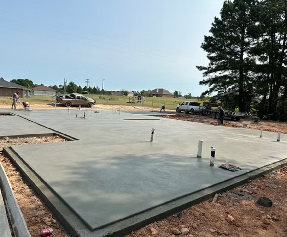 A concrete foundation is being built for a house