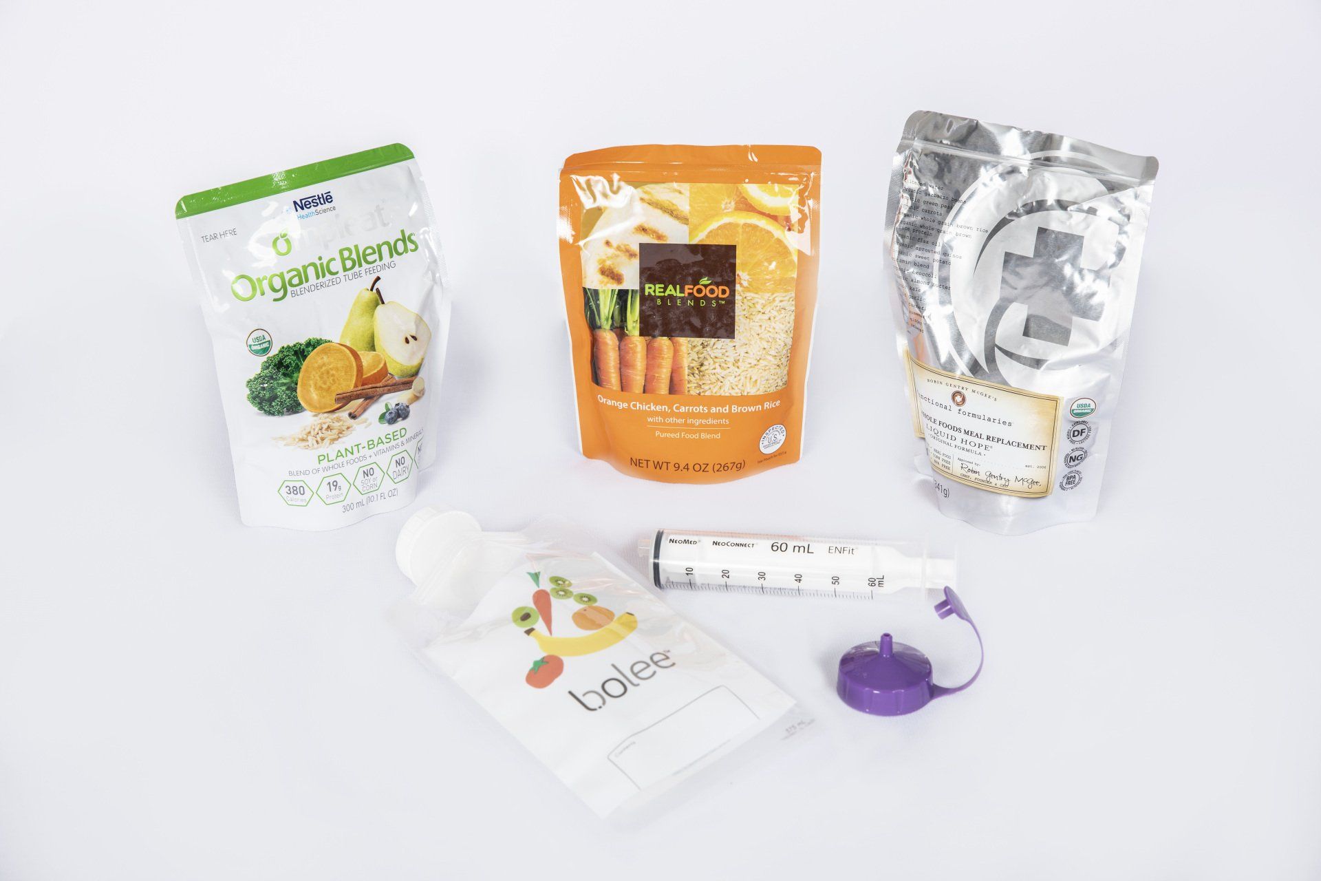 Bolee Bag, 6oml enfit reusable syringe, enfit transfer lid and commercial tube feeding pouches