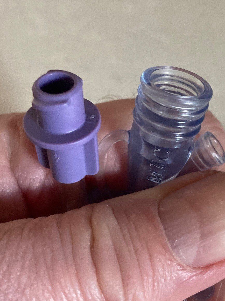 Enfit connector next to a funnel connector