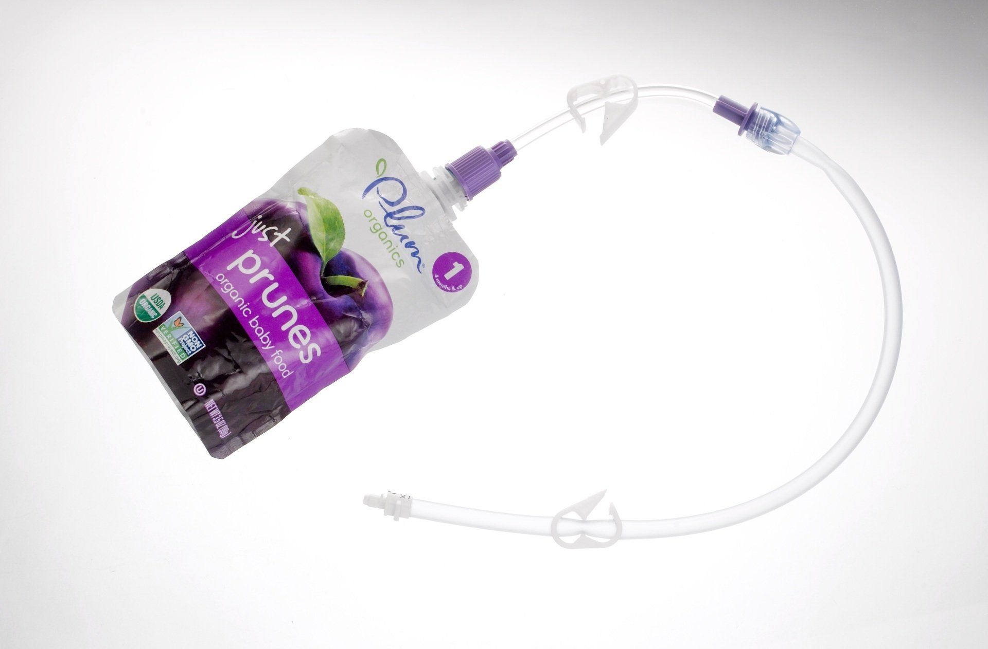 Bolink Small Cap attached to a puree pouch and bolus extension set