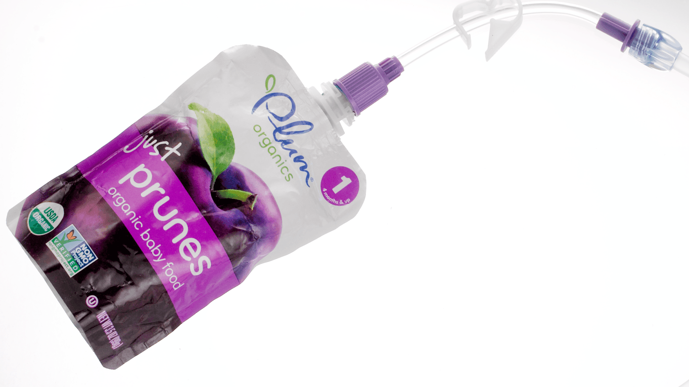 Bolink Small Cap connected to a puree pouch and bolus extension set