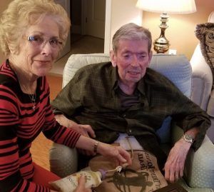 Couple using the Bolee Bag and Bolink Large Cap for tube feeding