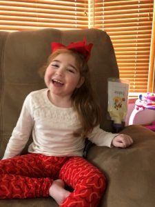 Young child using the Bolee Bag and Bolink Large Cap for home tube feeding
