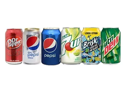 A group of soda cans are lined up in a row on a white background.