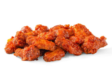 A pile of buffalo chicken wings on a white background.