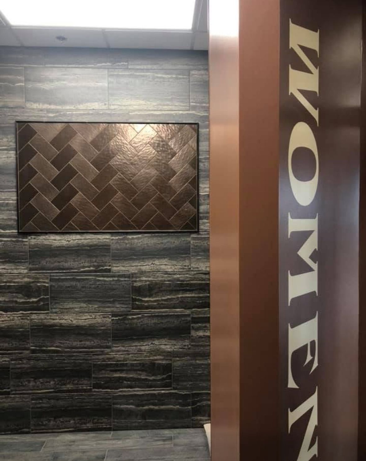 Bathroom entrance. Brown pillar with 