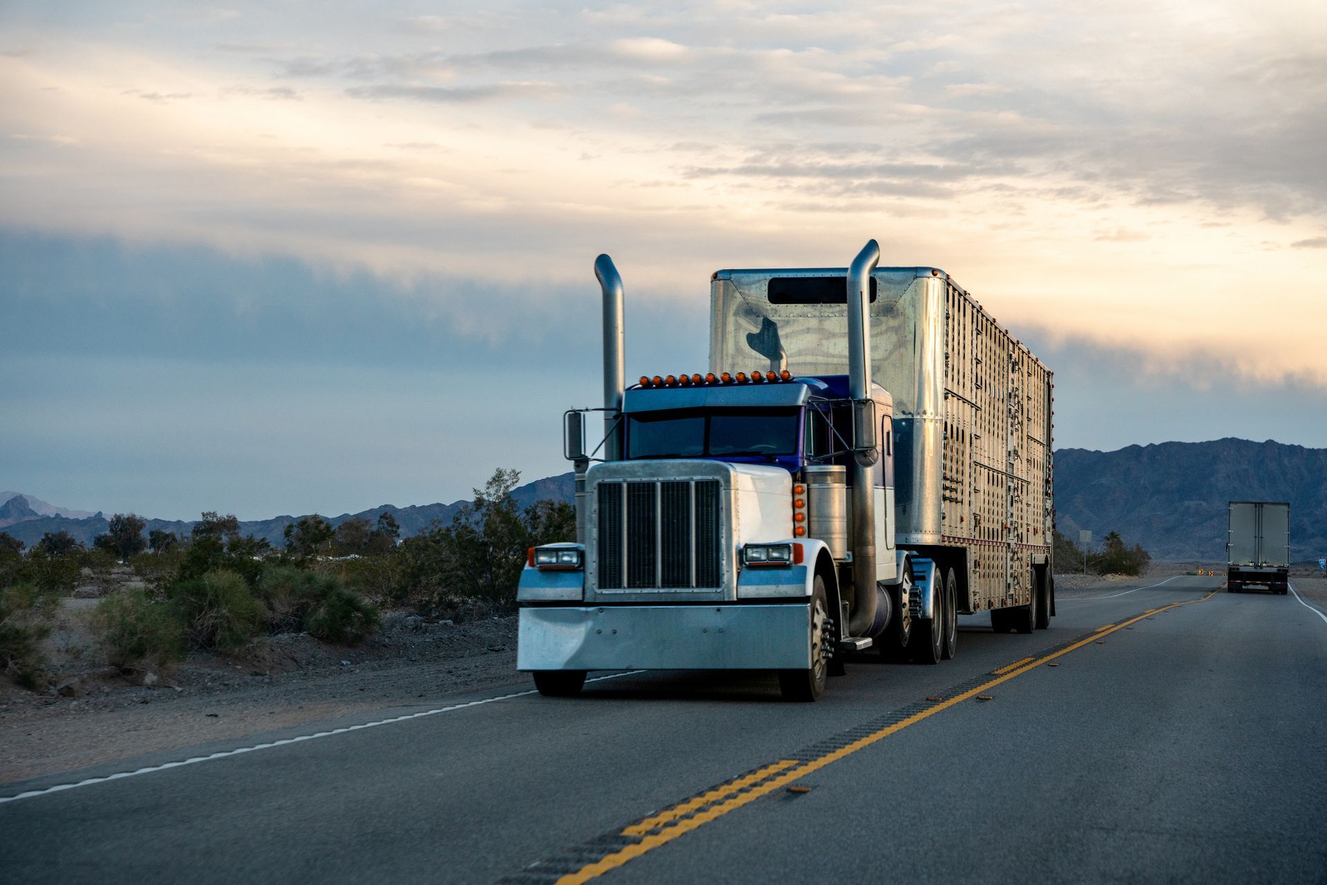 A truck on the highway transporting cargo during a long-distance heavy hauling operation A truck on the highway transporting cargo during a long-distance heavy hauling operation