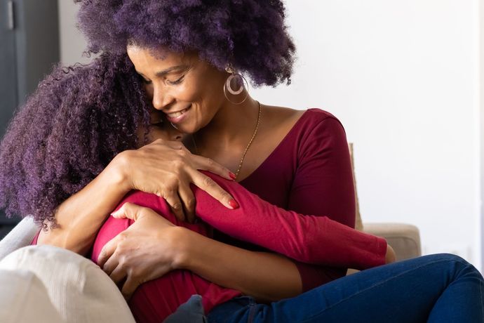 Mother Hugging Daughter