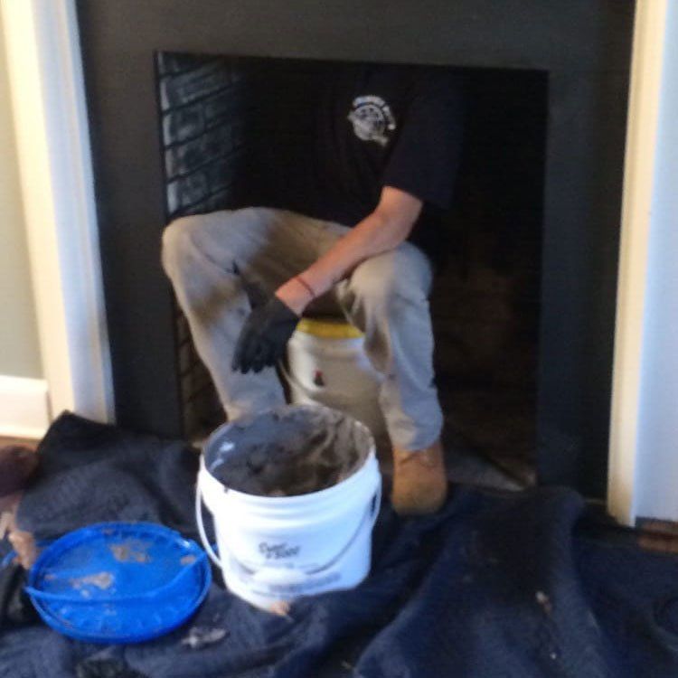 Man Cleaning Inside Chimney — Wayne, NJ — Chimney Pros Man Cleaning Inside Chimney — Wayne, NJ — Chimney Pros